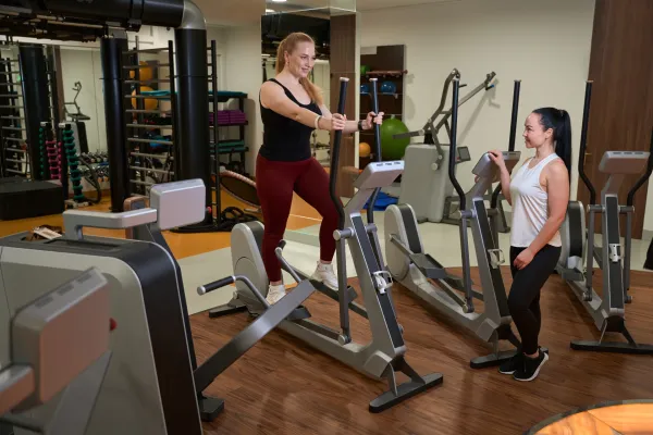 two-women-are-in-the-gym-of-a-fitness-clinic-2025-03-05-14-48-53-utc-6914ab1ef0056